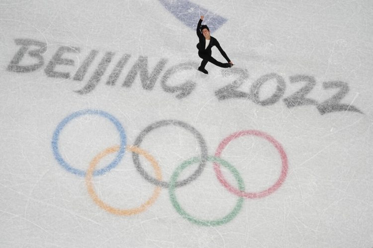 Chen flips, spins way to world-record score at Olympics